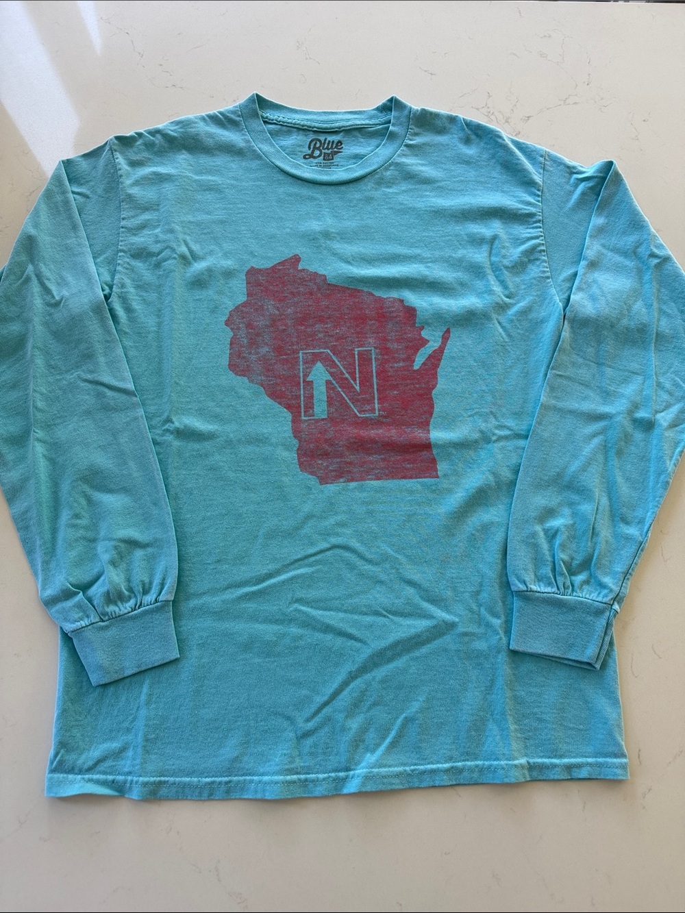 Wisconsin Blue 84 Turquoise Long-Sleeve Tee with Red Graphic.  
Size: M NWOT